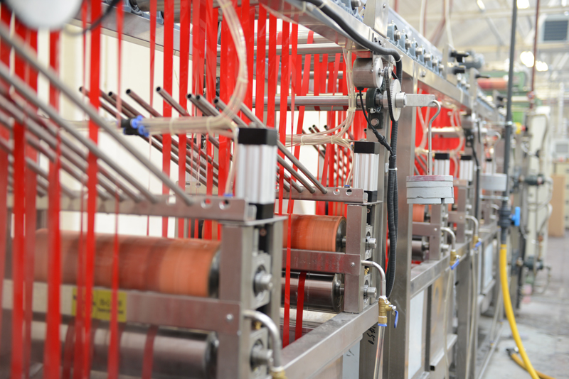 Ribbon being dyed in Preston